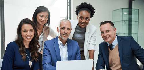 Image - Portrait of a group of businesspeople working together on a laptop in a modern office